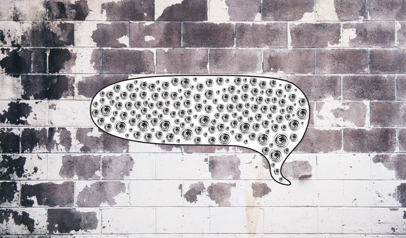 Globo de diálogo sobre un muro de ladrillos despintado. Ilustración: El Toque.