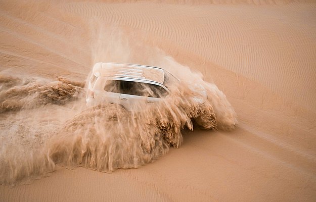 Dune bashing adventure in Al Khatim Desert during evening safari in Abu Dhabi
