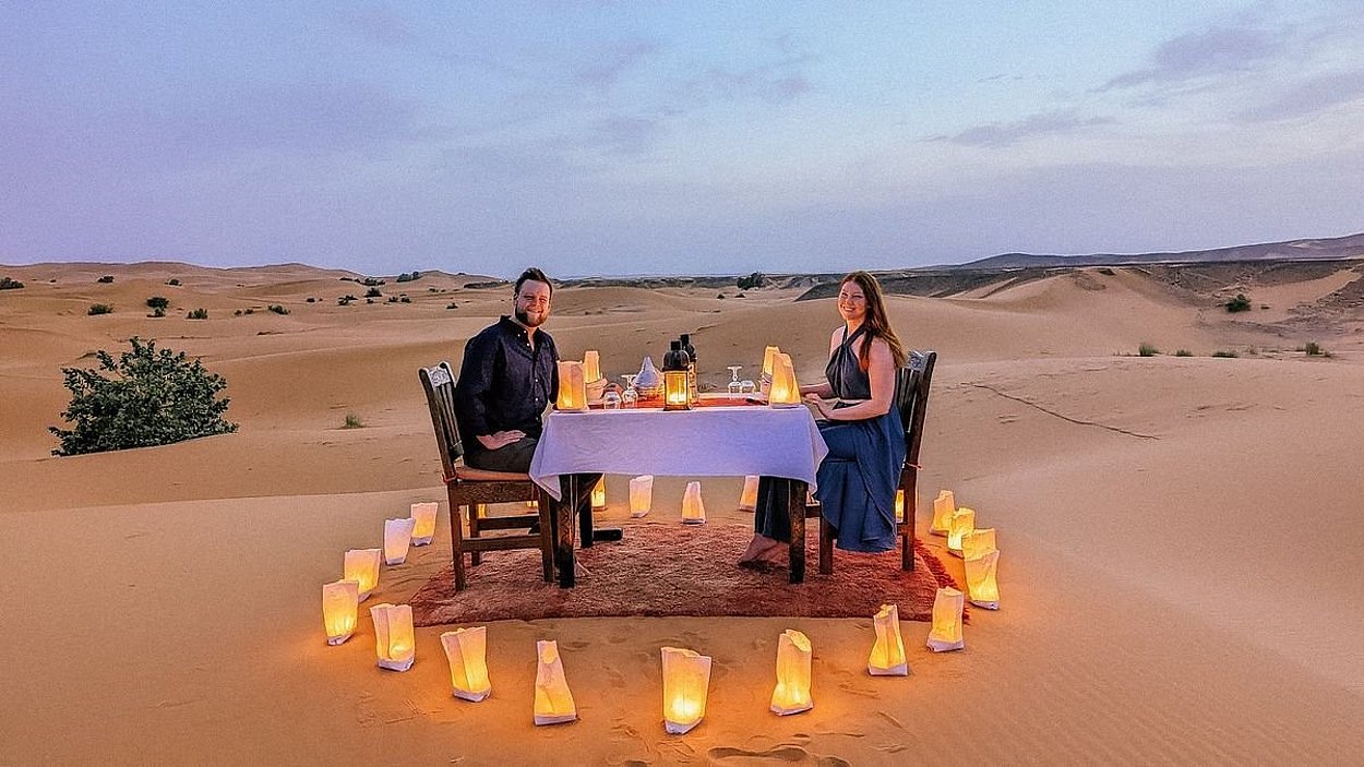 Private luxury dune dinner in Abu Dhabi with exclusive seating, romantic decor, and panoramic desert views