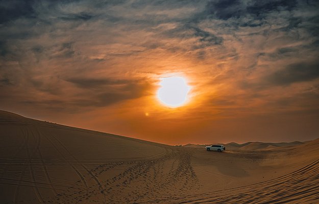 Sunset during liwa overnight desert safari