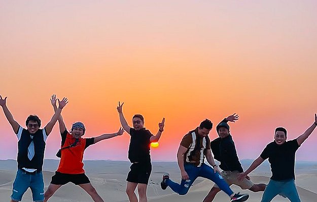 Camel Ride at Sunset in Abu Dhabi Desert Safari Tour