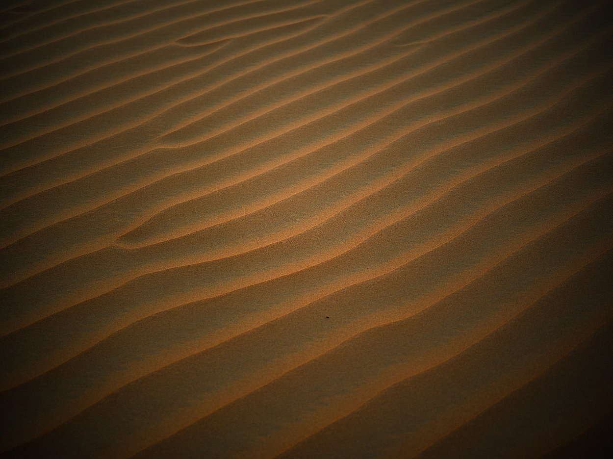 Natural wind-shaped sand textures and ripple patterns in Al Quaa desert Abu Dhabi