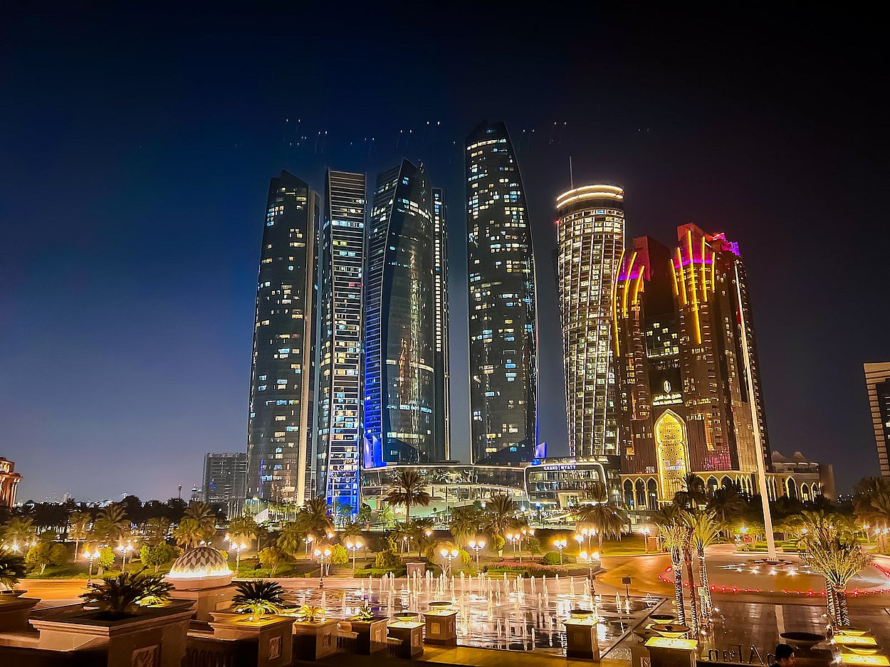 Etihad Towers and Abu Dhabi skyline lit up at night