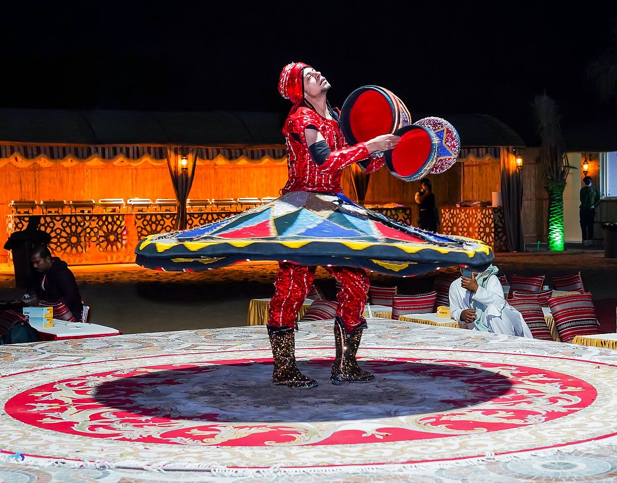 Tanoura dancer spinning with colorful LED costume
