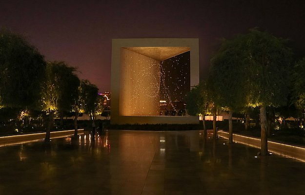 Wahat Al Karama memorial glowing at night in Abu Dhabi