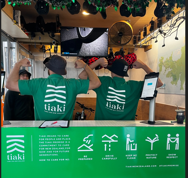 Tiaki tshirts in green booth