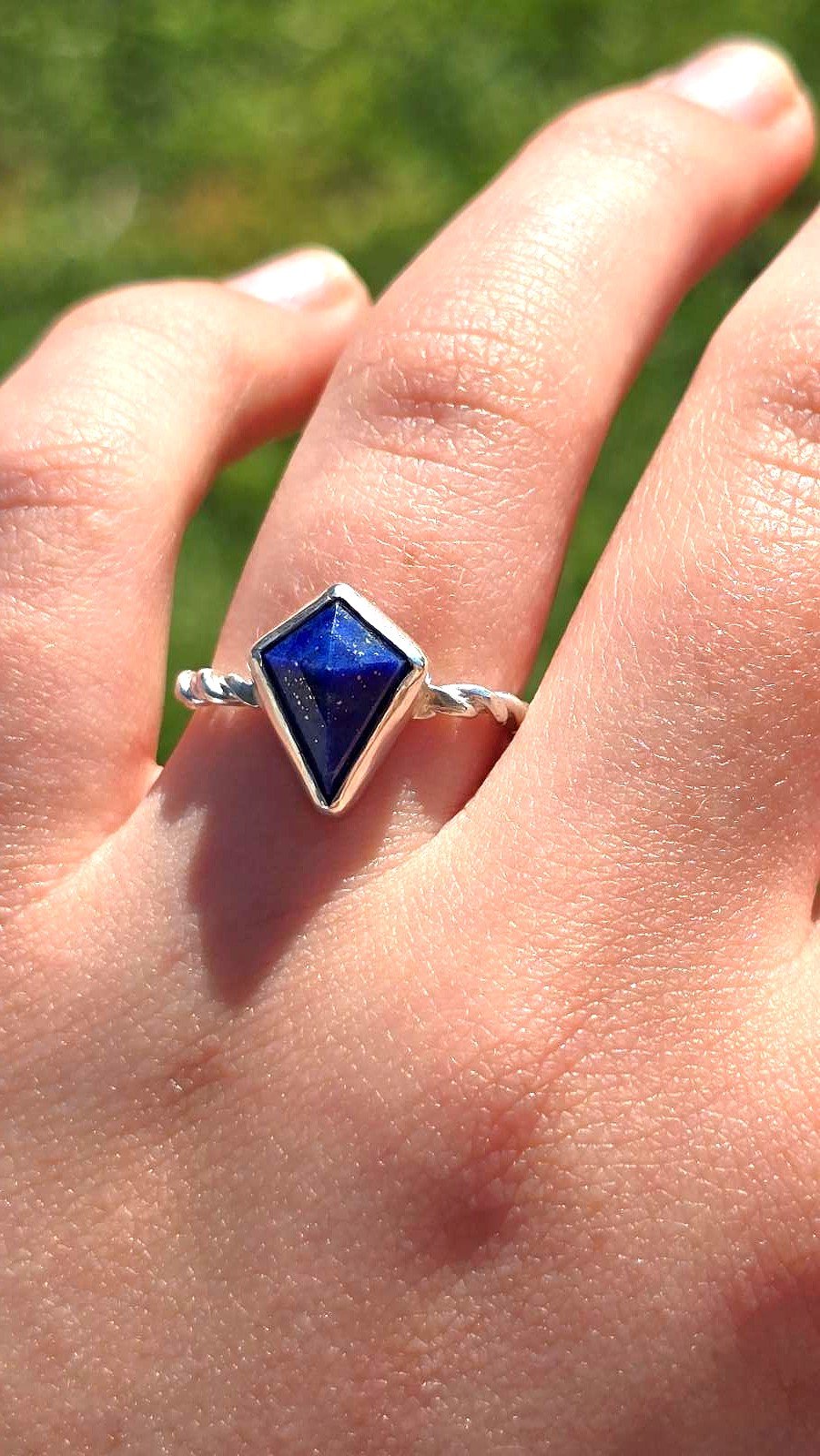 blue gemstone ring kite cut on ring finger