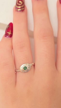 Emerald Sunburst Ring worn on hand