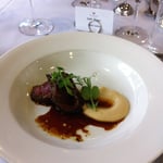 Peppered crusted venison with parsnip truffle puree and pinot jus