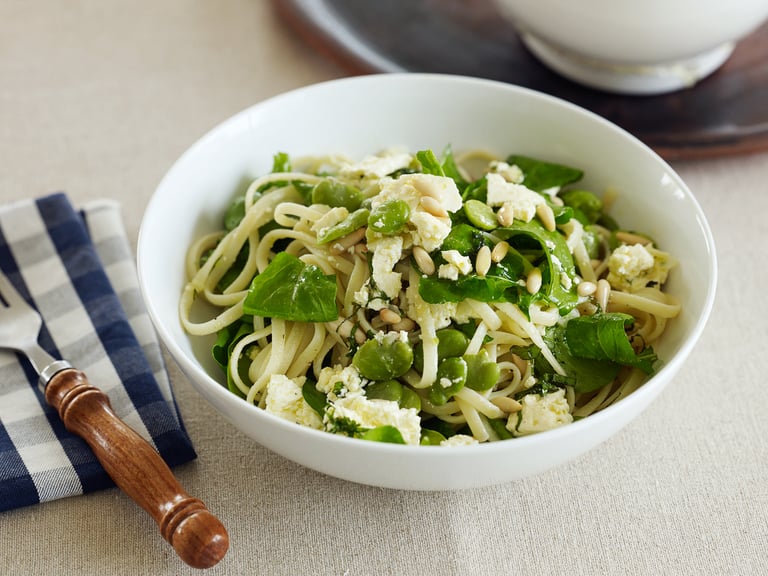 Linguine with rocket, marinated feta, broad beans, pine nuts