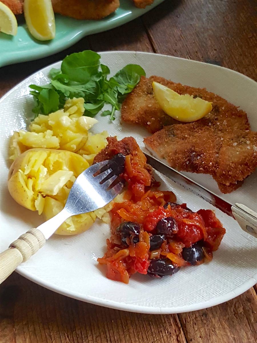 Golden snitzels with tomato & olive salsa