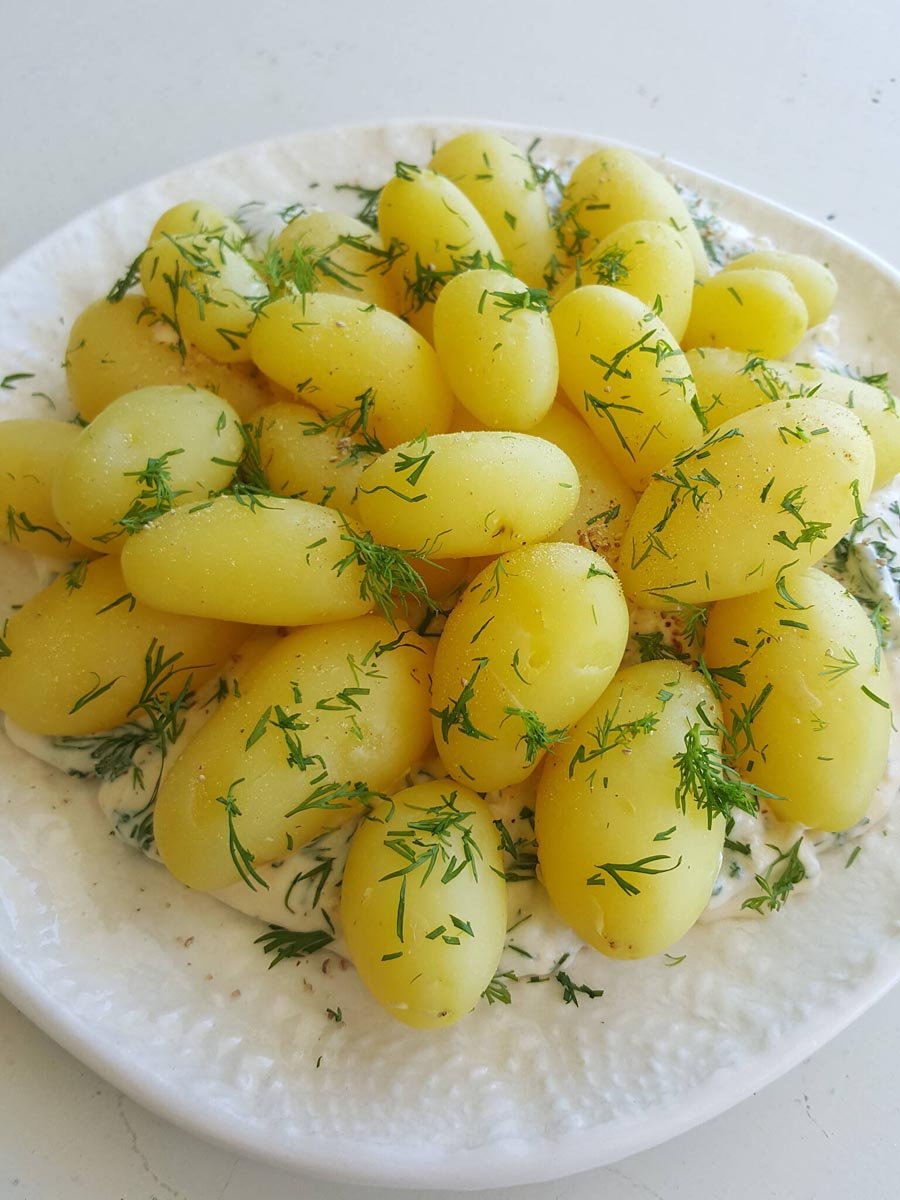 Top baby potatoes & horseradish Sauce with hot-smoked salmon