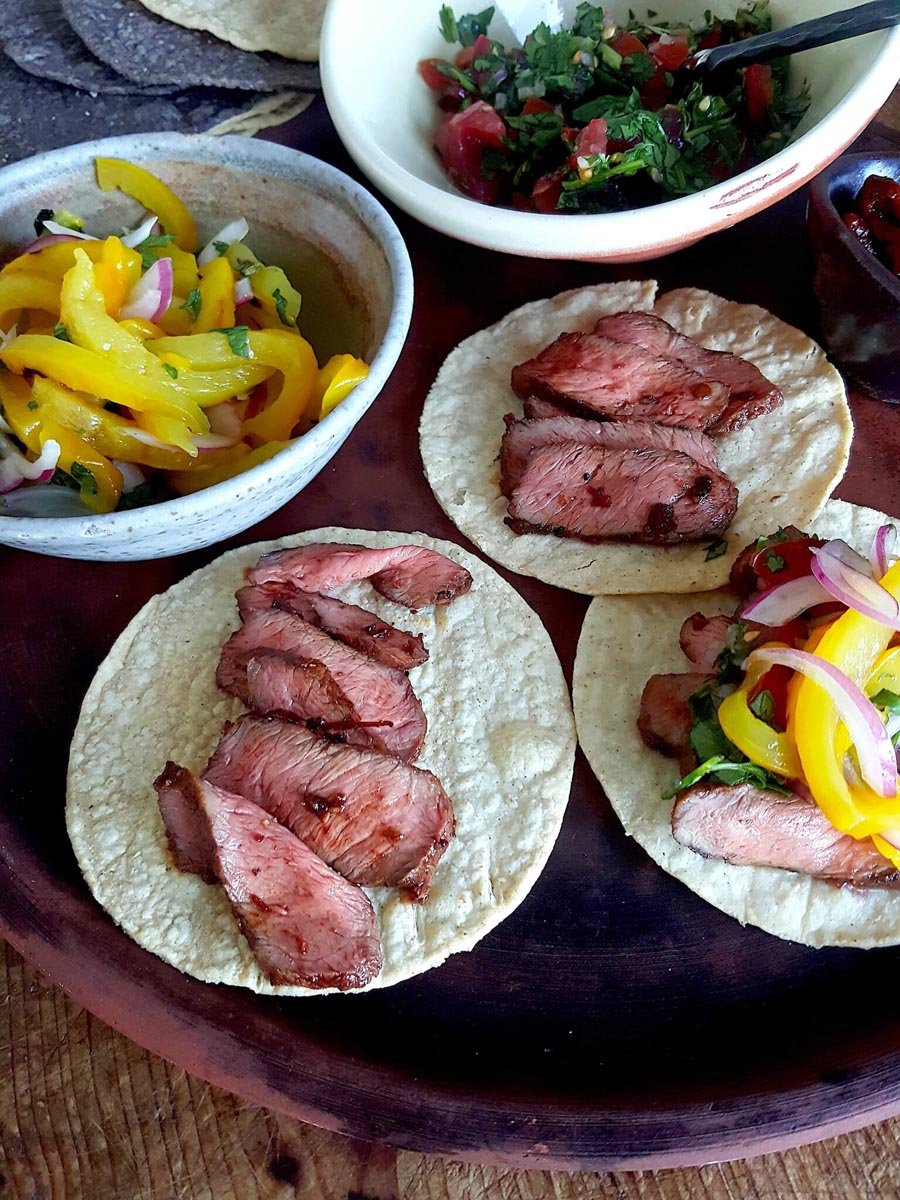 Flat iron steaks on tostadas