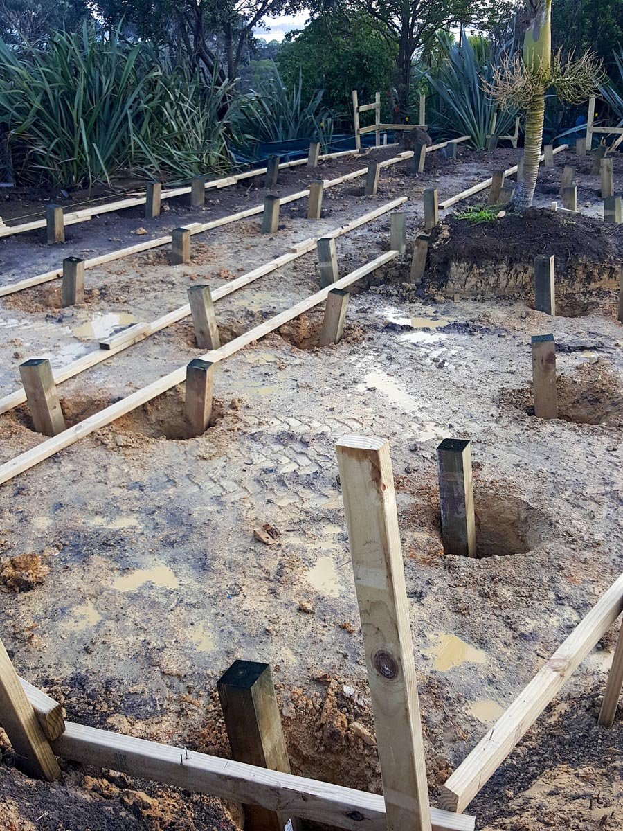 My Housette! Holes dug & piles in!