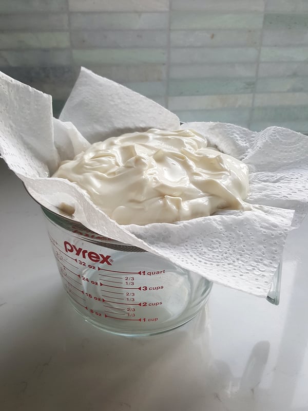Draining yoghurt for labna.