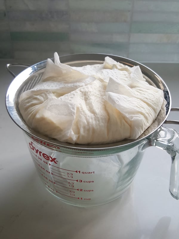 Draining yoghurt for labna.