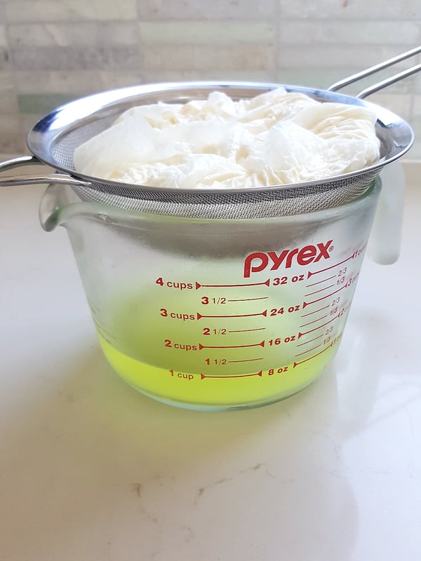 Draining yoghurt for labna.