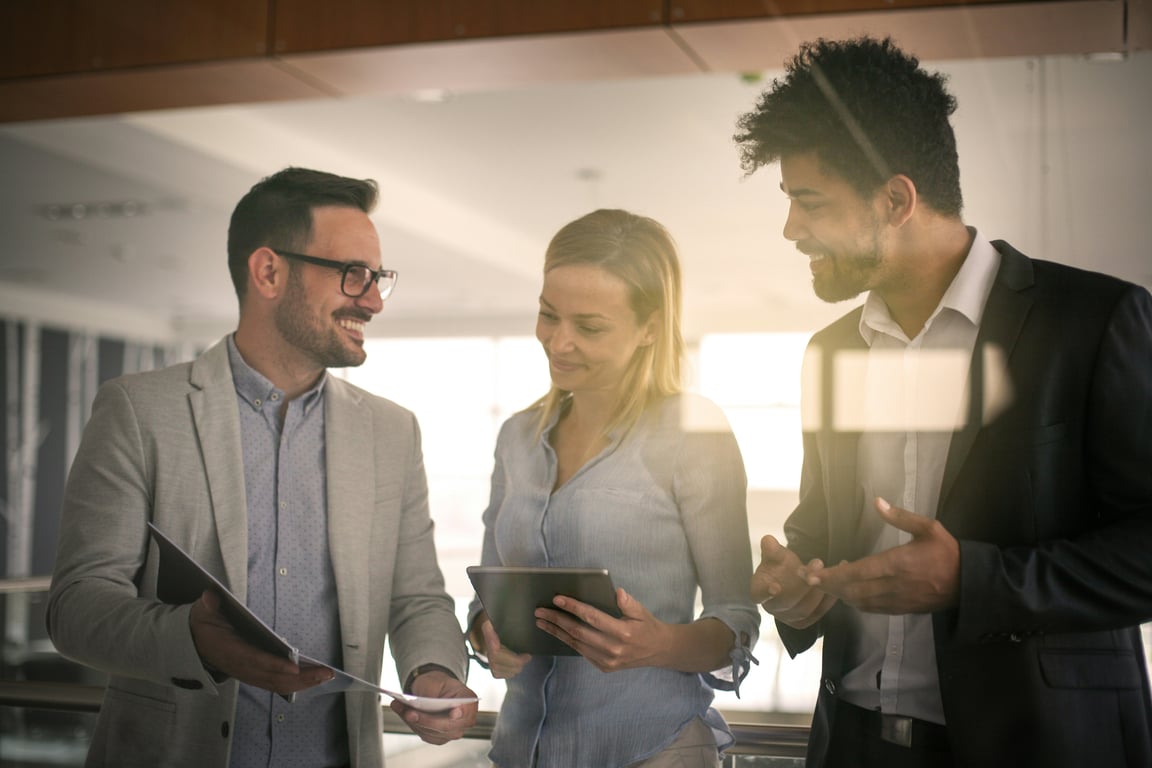 People discussing with tablets