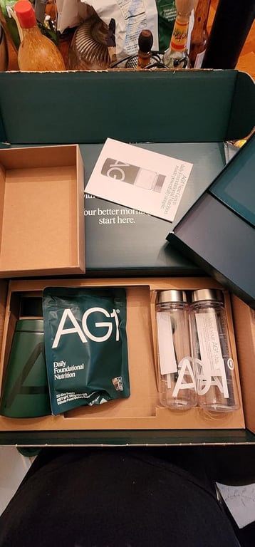 The AG1 welcome kit with canister, travel packs, vitamin D3+K2 drops and shaker