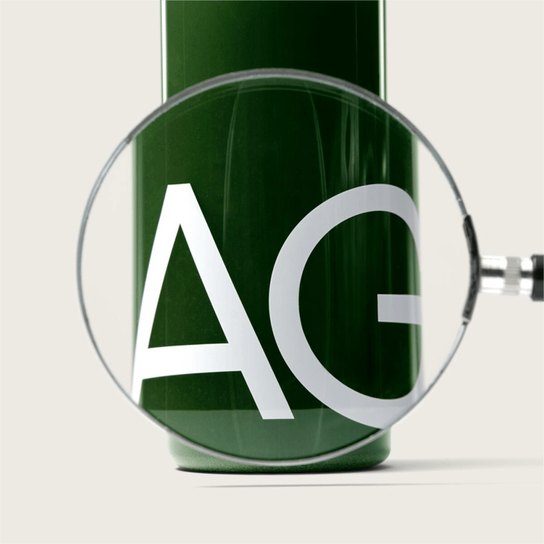 An AG1 canister photographed under a magnifying glass