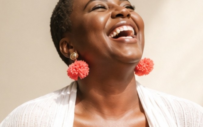 A woman laughing, head back