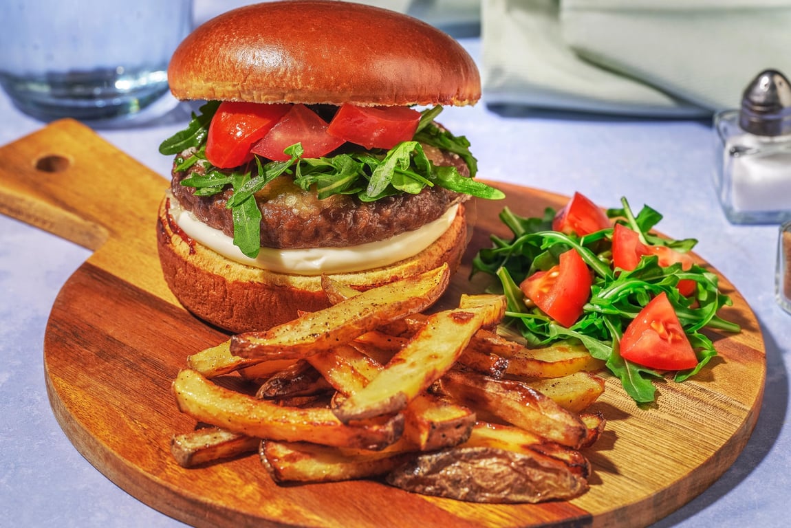 Burger and wedges plated for a family dinner