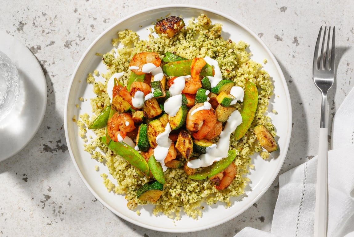 Prawns, courgette and sugar snap peas on herby couscous