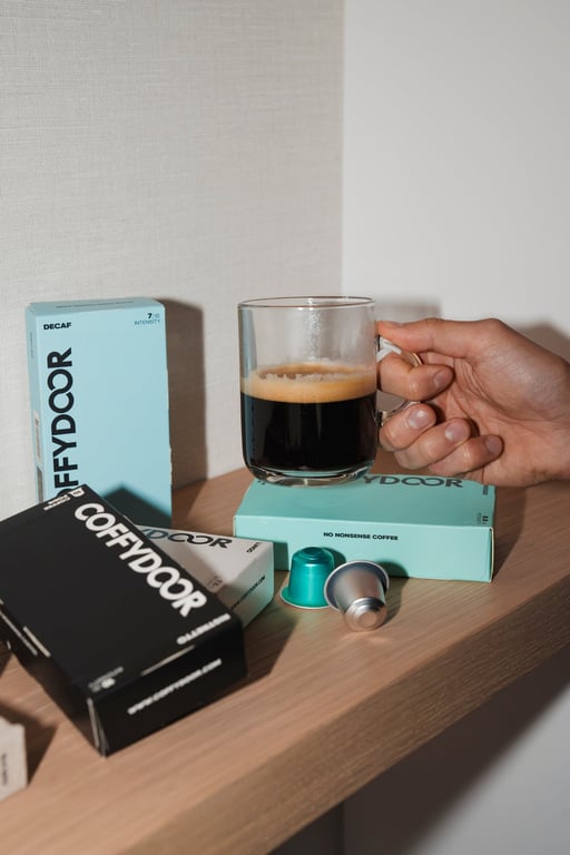 Coffydoor capsule boxes stacked, showing the three blends