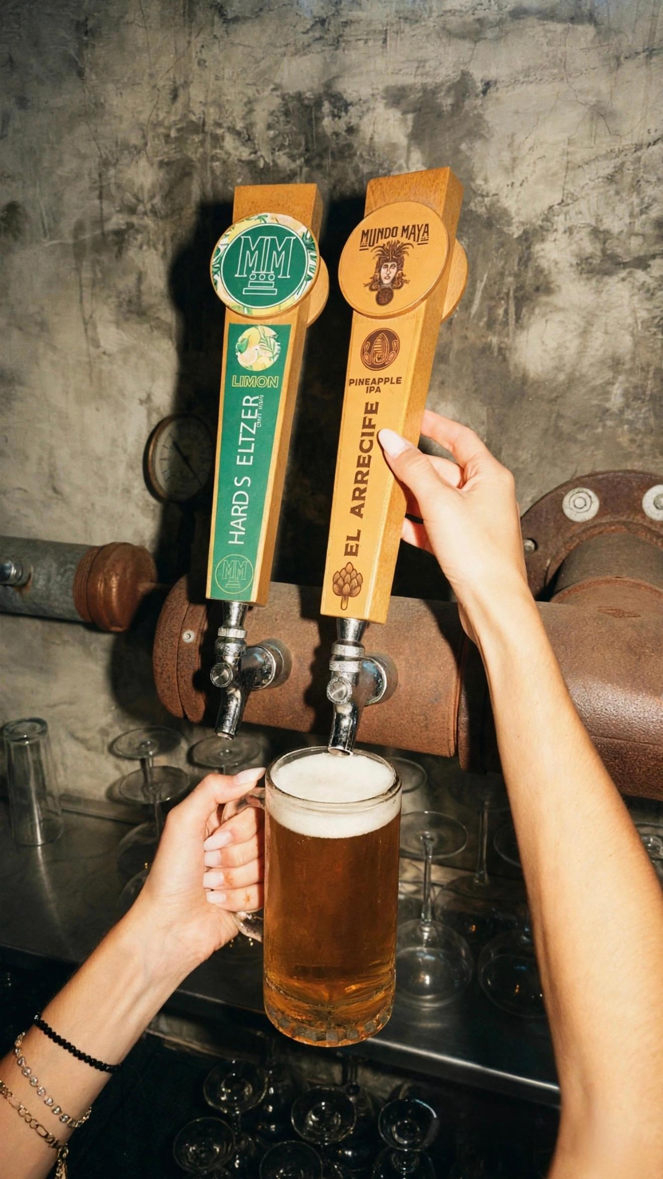 A person pours draft beer