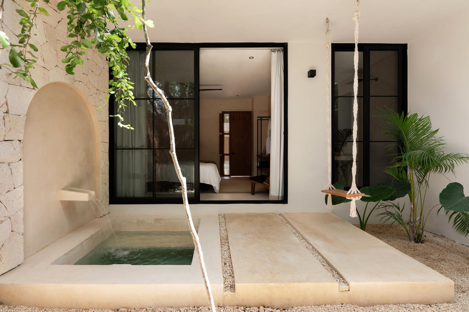 Plunge pool beside an arched wall