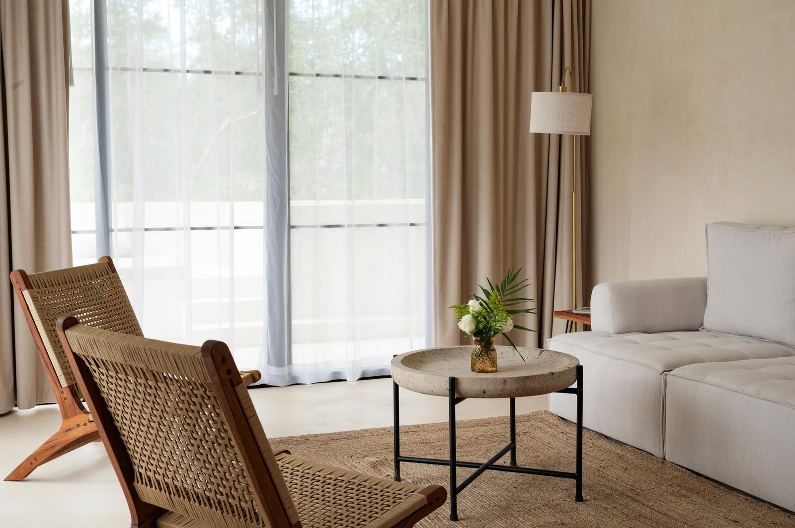 Lounge seating by the glass wall
