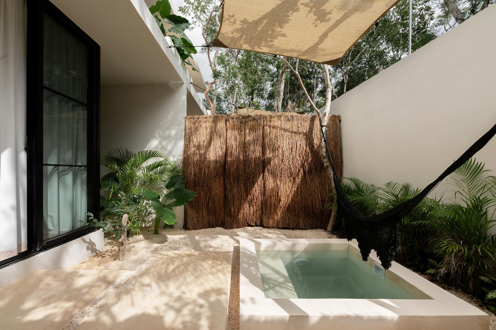 Plunge pool under a shade sail