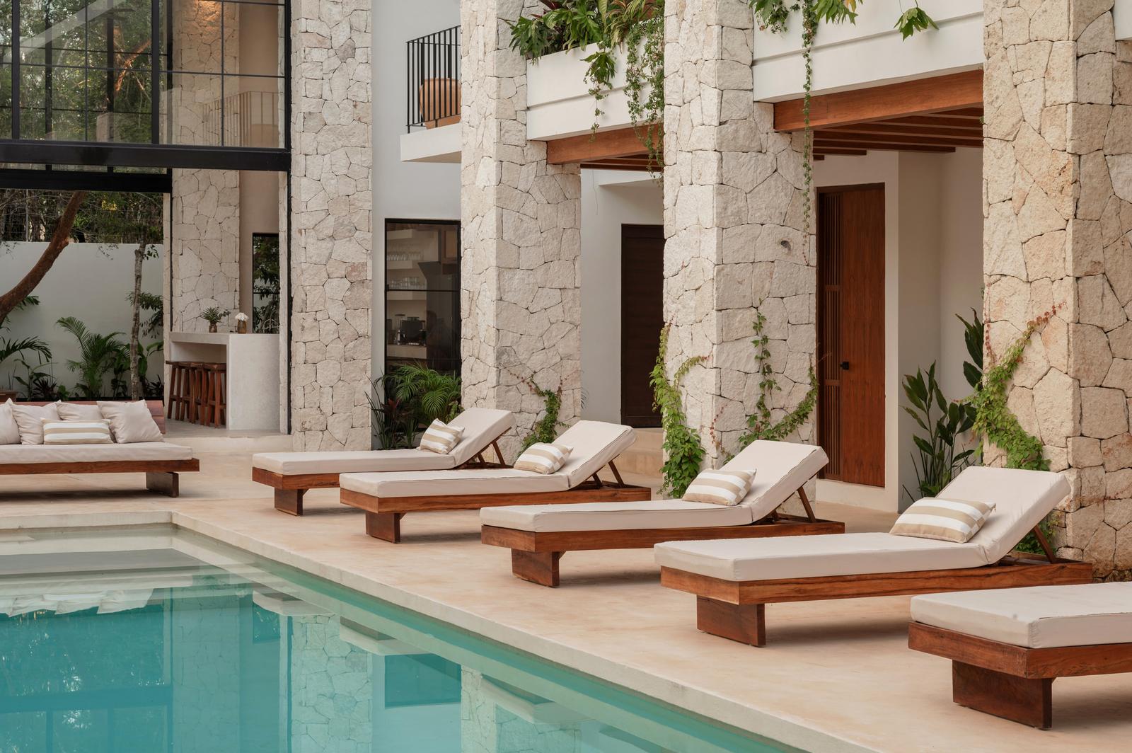 Loungers lined along the pool