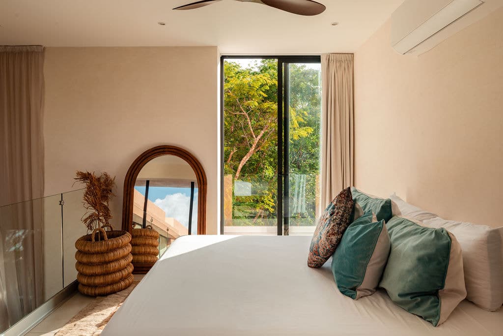 Bedroom with arched window and garden view