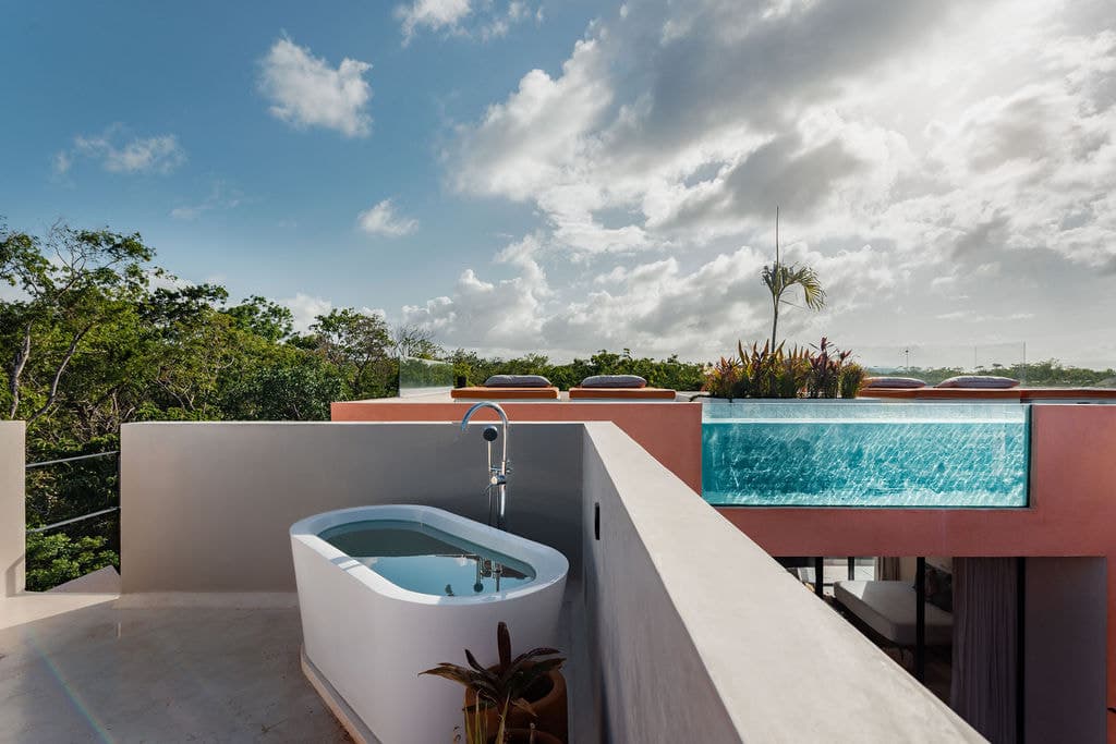 Rooftop bathtub beside the pool