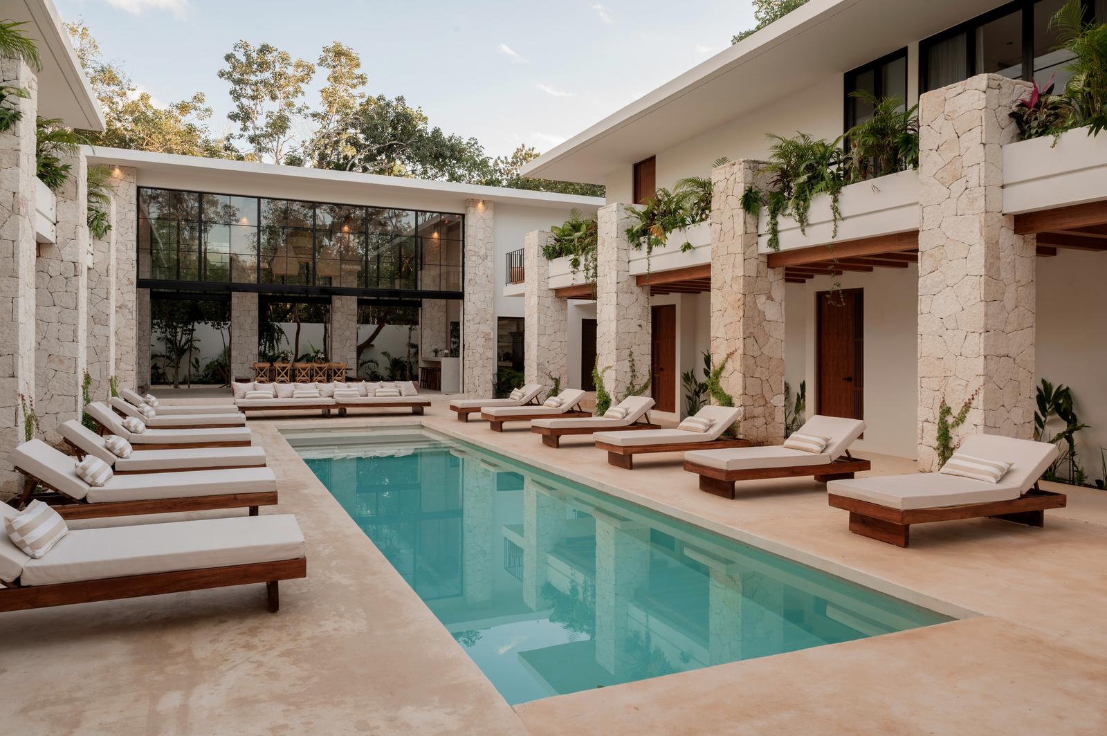 The main pool with loungers along both sides