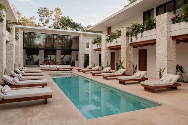The main pool with loungers along both sides