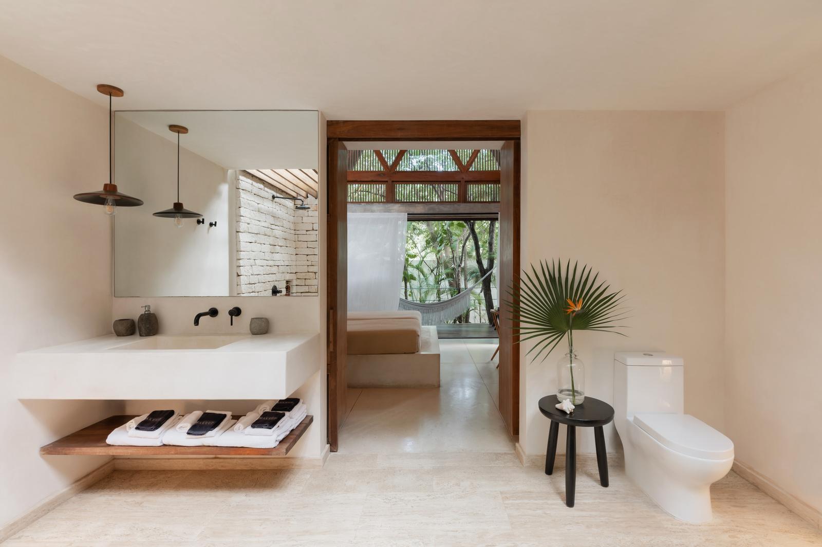 En-suite with twin basins, opening to the terrace