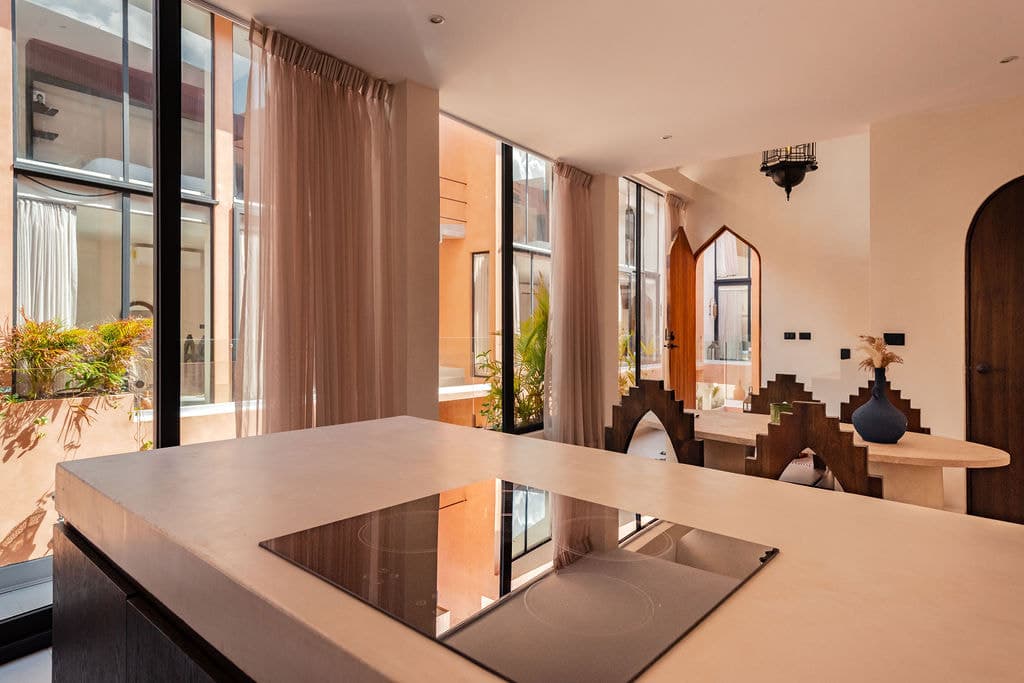 King bedroom with timber wall and terrace