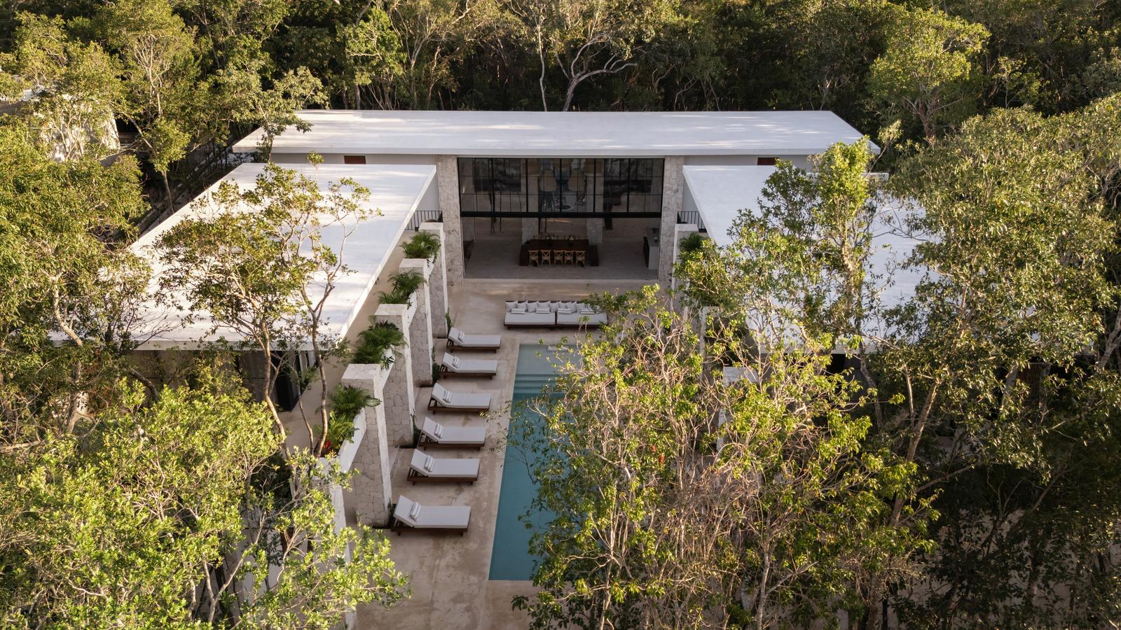 Hacienda Babylon from above, the pool running down the centre