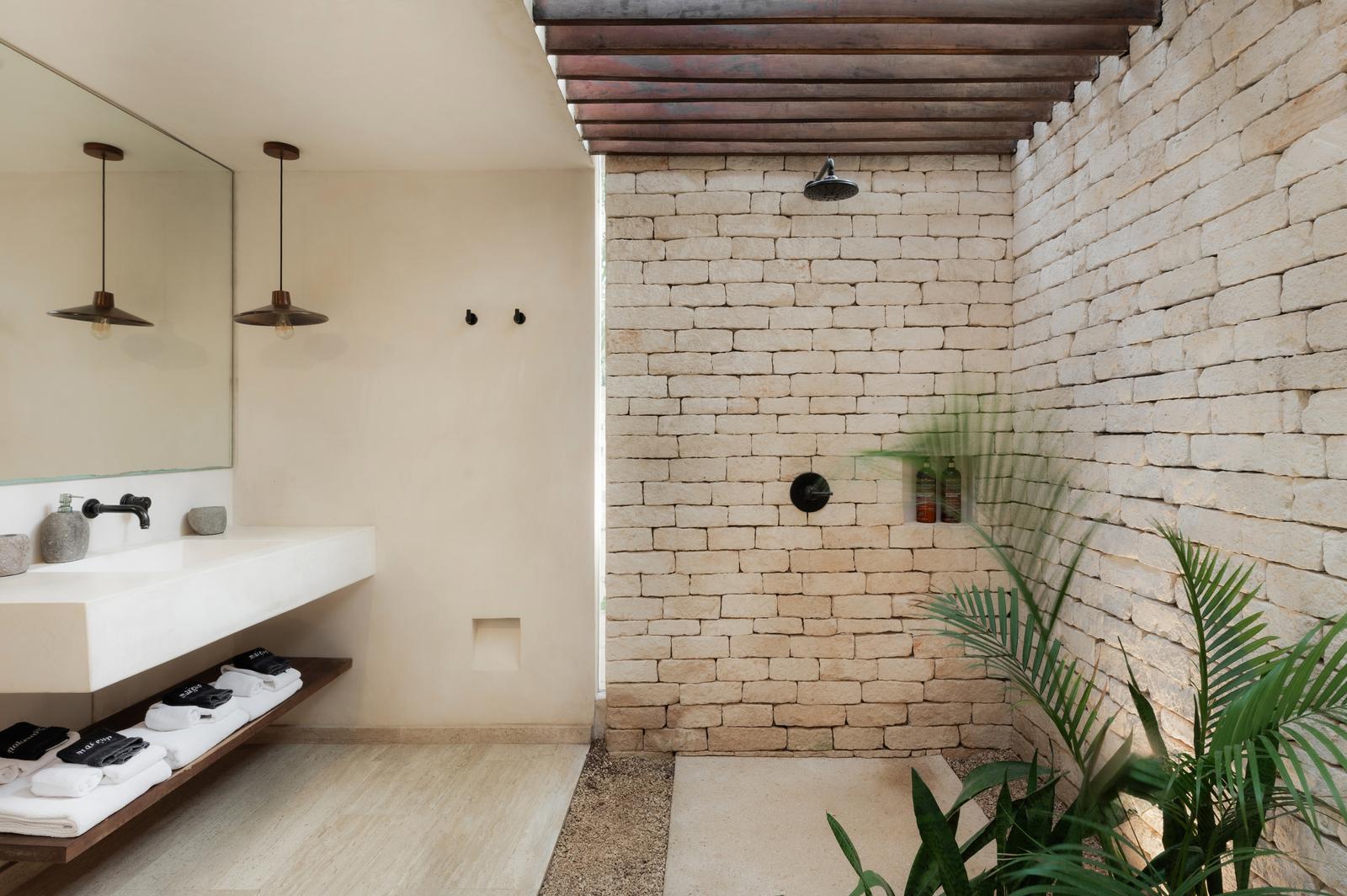 Bathroom with twin basins and an outdoor shower