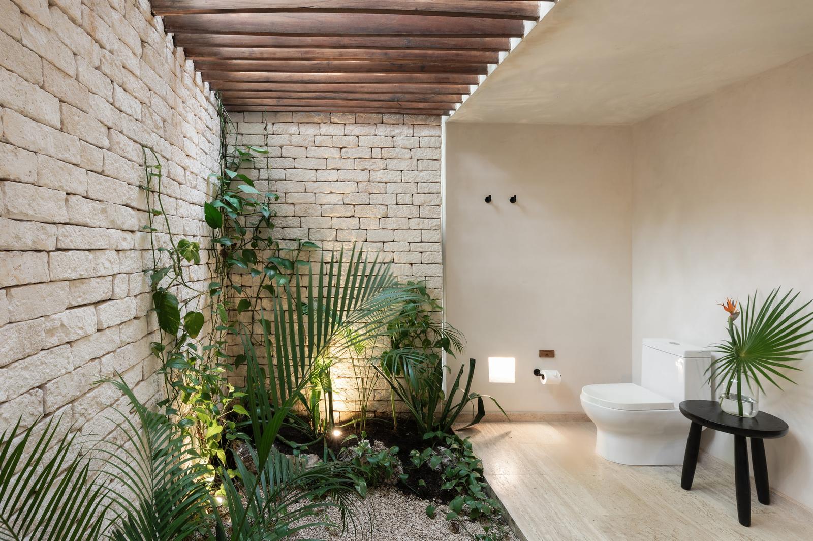 Open-to-sky bathroom with planting