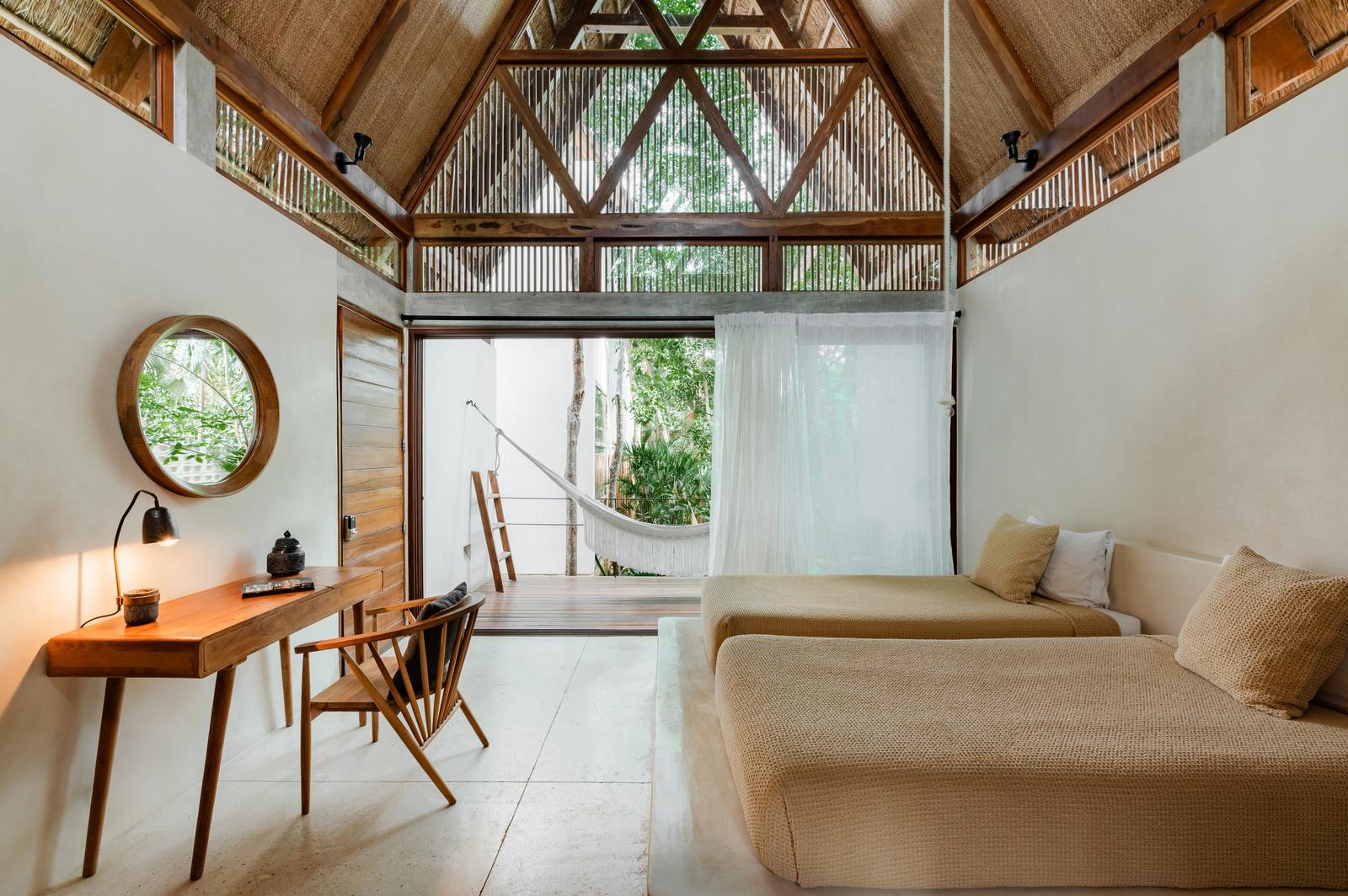 King bedroom with a writing desk and terrace hammock