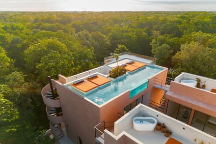 Aerial view of Palma y Arco showing the rooftop pool and surrounding jungle