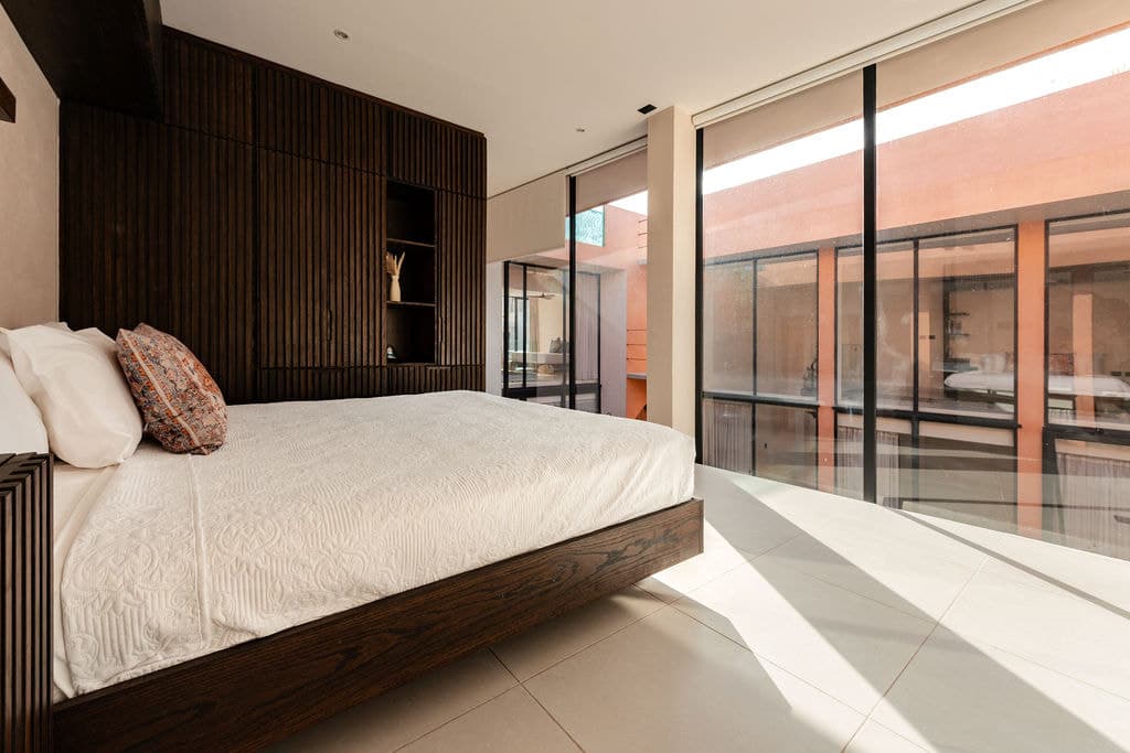 Bedroom with dark timber panelling