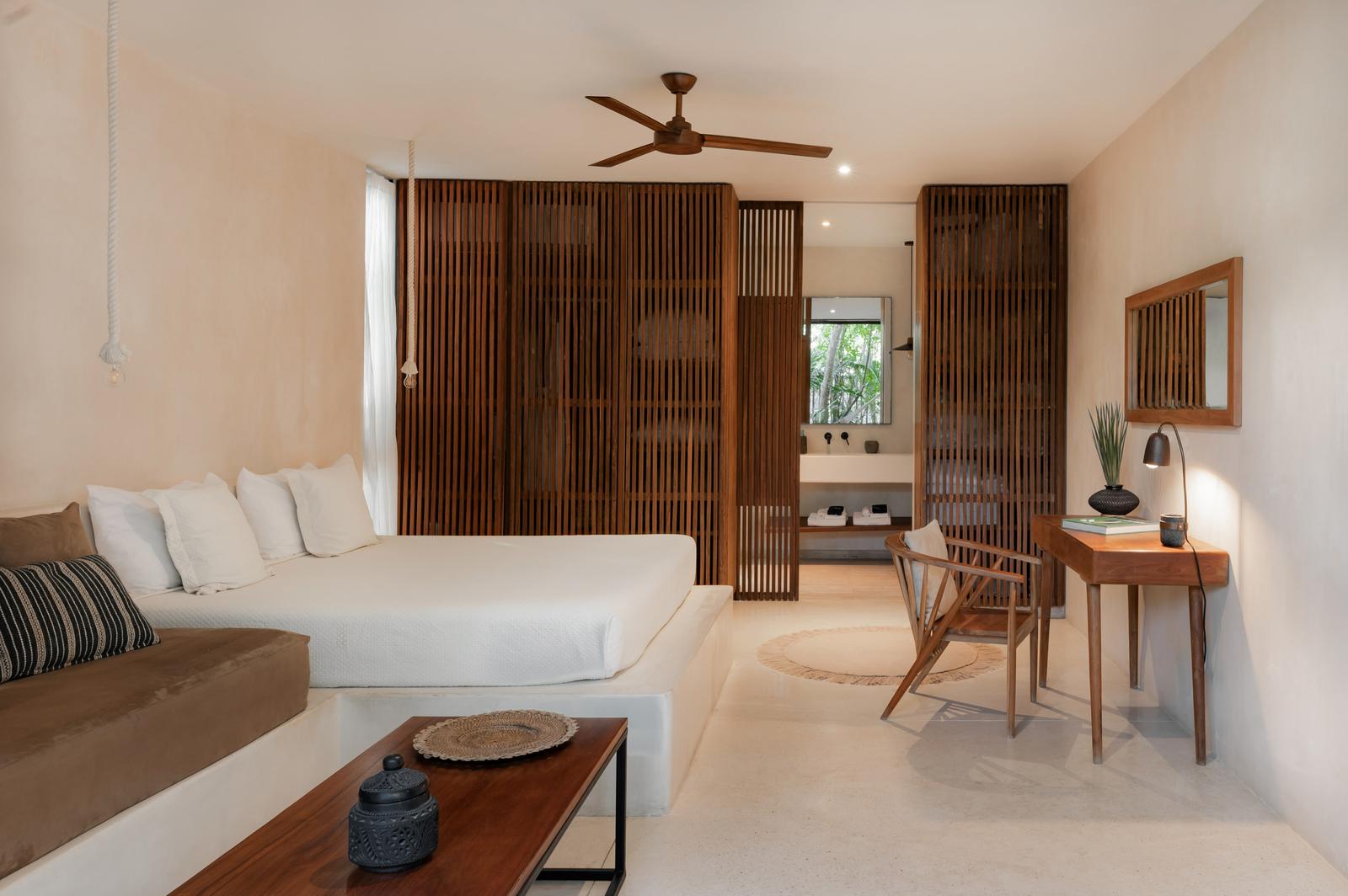 Lodge interior with daybed and timber louvred screens