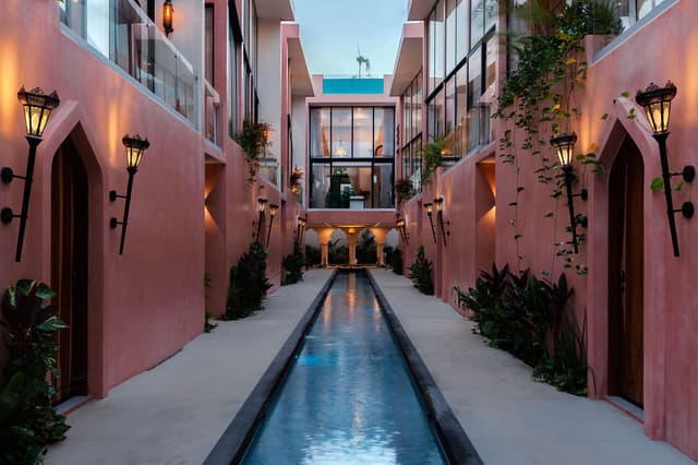 The water channel between the two wings, lit at dusk