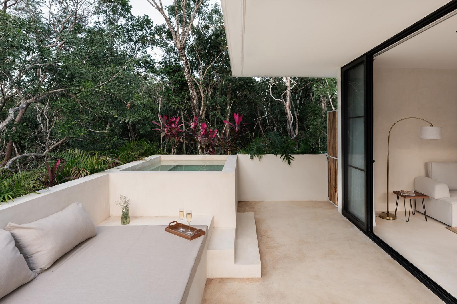 Daybed beside a private plunge pool