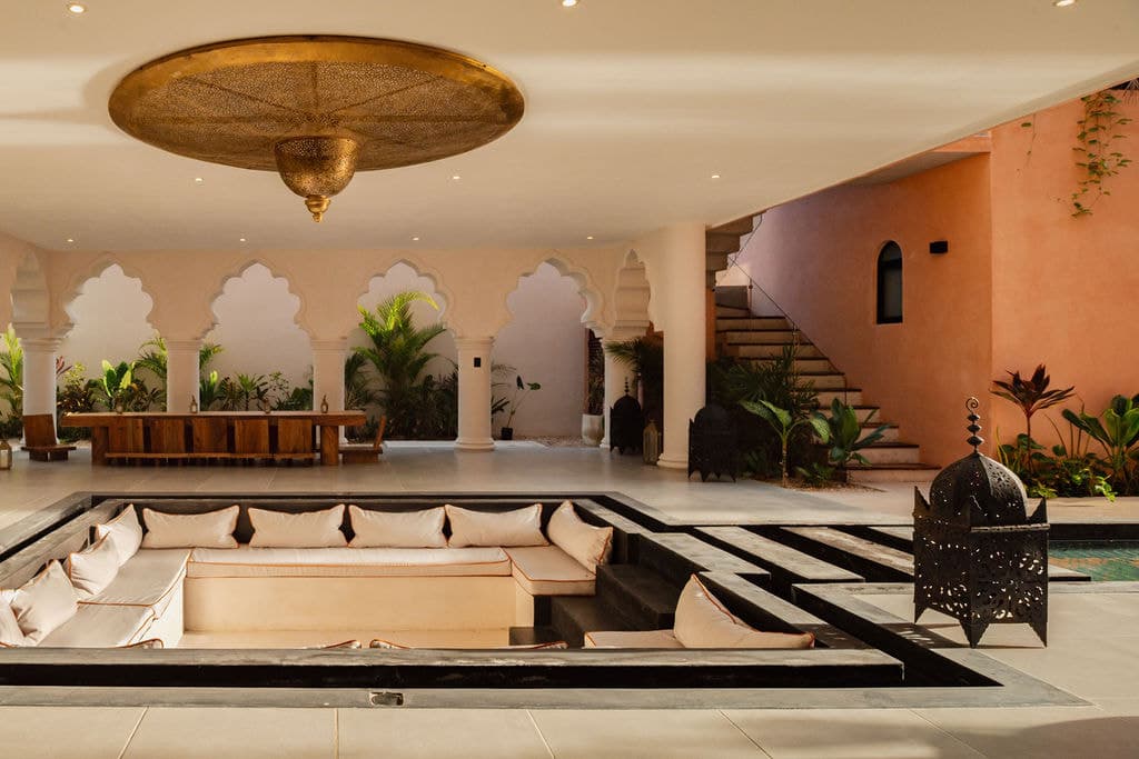 Main lounge with scalloped arches and a sunken seating area