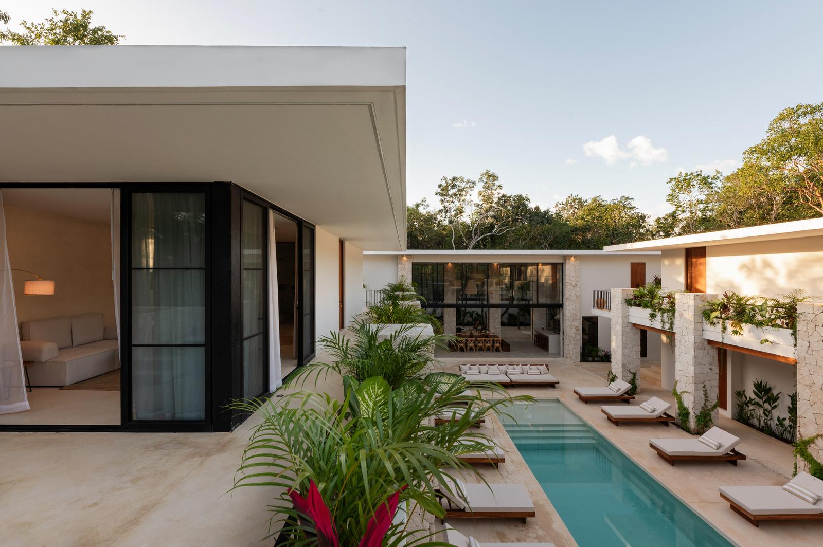Guest rooms opening onto the pool terrace